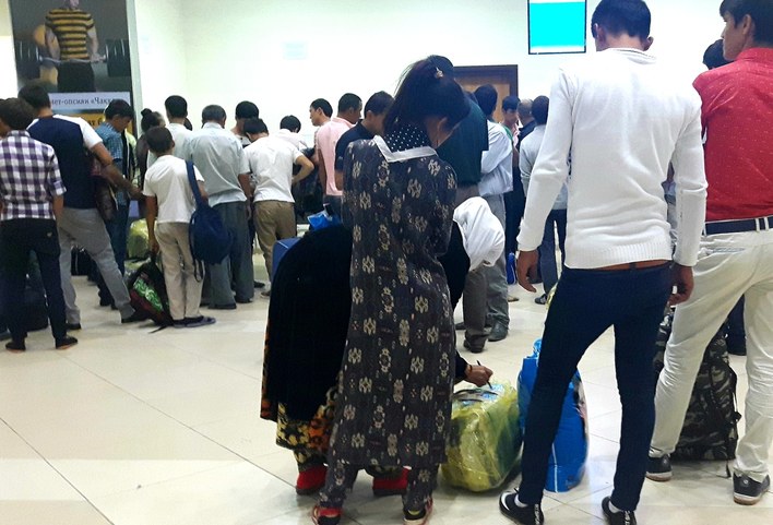 Relatives accompanying young men to the airport